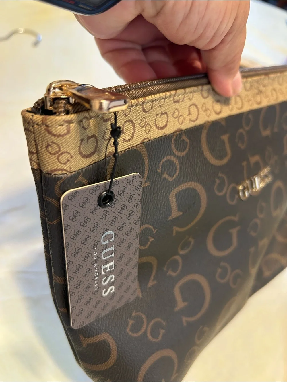 GUESS Brown Monogram Cosmetic Pouch with Gold Hardware